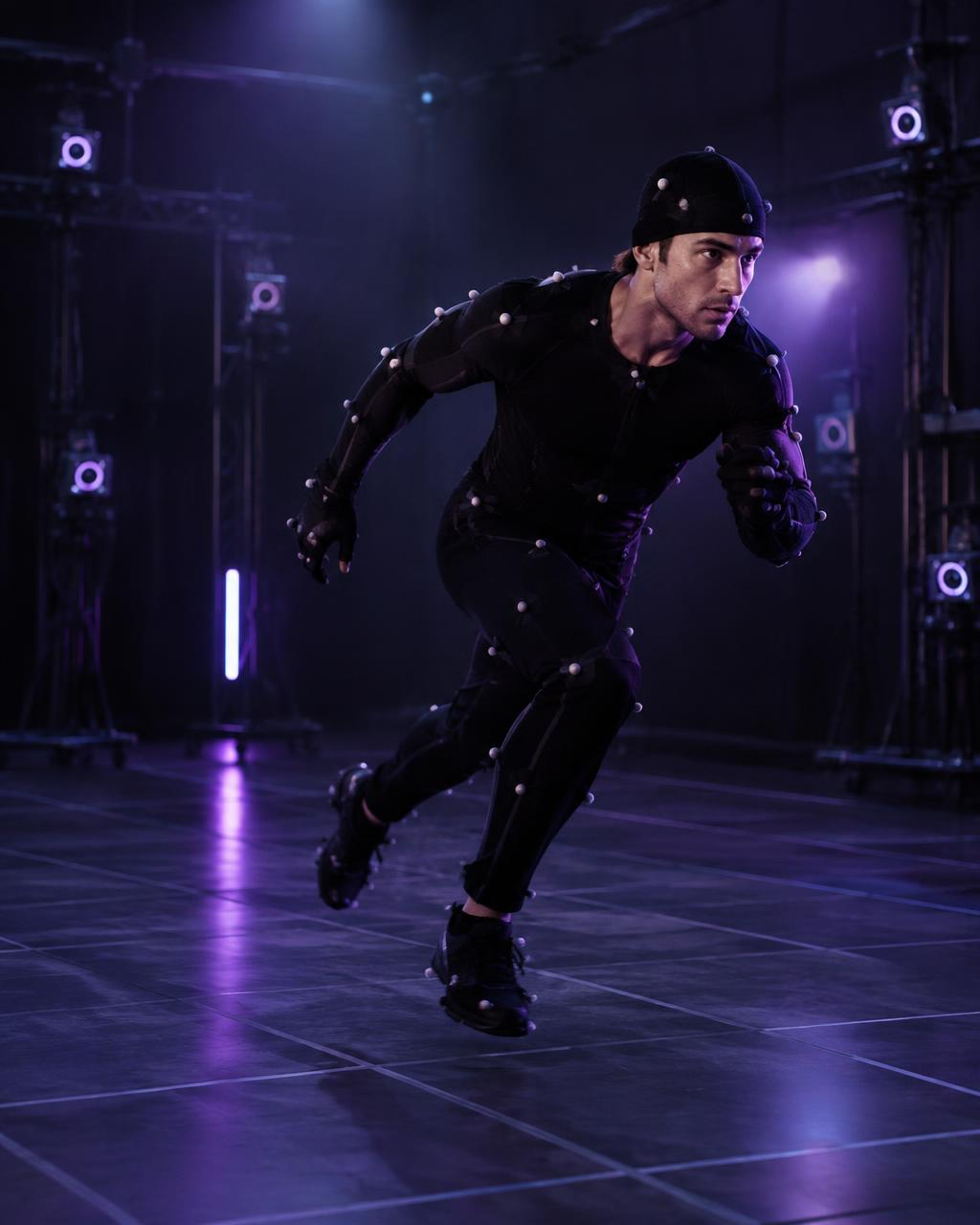 Athlete in a motion capture suit sprinting in a studio